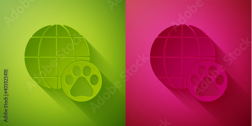 Paper cut World pet icon isolated on green and pink background. Paper art style. Vector.