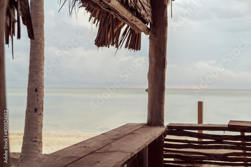 Fototapeta Naklejka Na Ścianę i Meble -  Tropical beach bar counter in sunrise