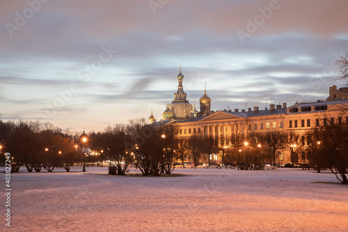 Beautiful architecture of evening Petersburg. Colorful sky, glowing lanterns. Cold winter evening. 