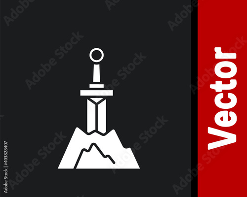 White Sword in the stone icon isolated on black background. Excalibur the sword in the stone from the Arthurian legends. Vector.