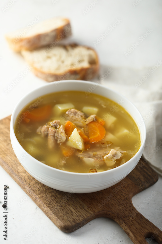 Traditional homemade salmon soup with vegetables Traditional homemade salmon soup with vegetables