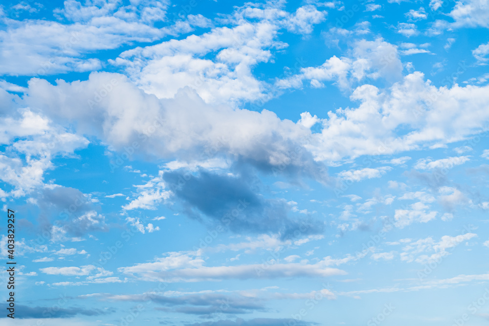 blue sky background with strangely shaped clouds, copy space. blue sky background with strangely shaped clouds, copy space.