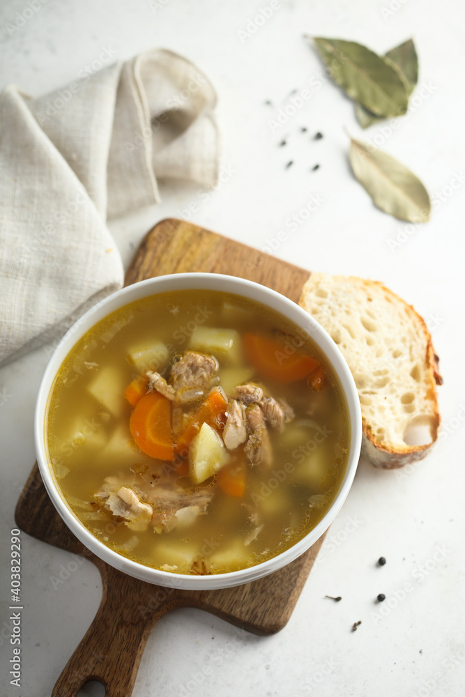 Traditional homemade salmon soup with vegetables Traditional homemade salmon soup with vegetables