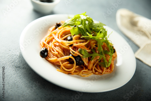 Pasta with olives and arugula