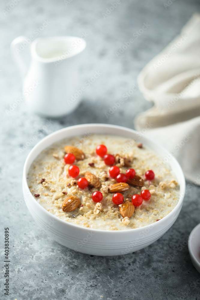 Healthy oatmeal porridge with berries and almond Healthy oatmeal porridge with berries and almond