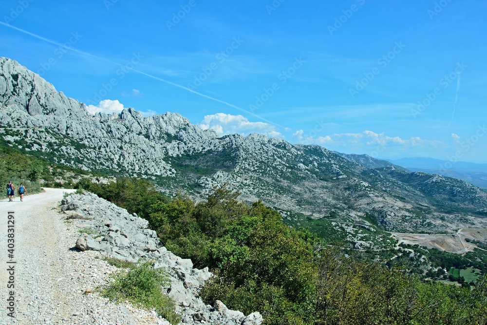 Croatia-view of the tourists and rocky city of Tulove Grede in the Velebit National Park