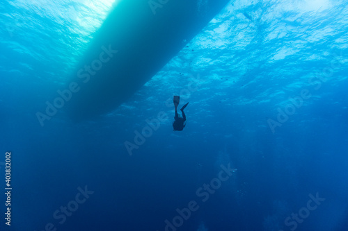 diving yacht bottom view from under the water © константин константи