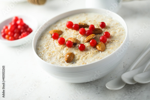 Healthy oatmeal porridge with berries and almond