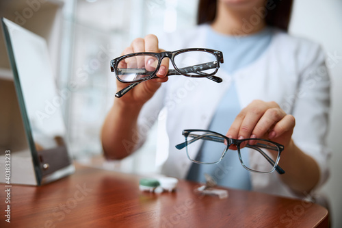 Medical worker providing two variants of glasses