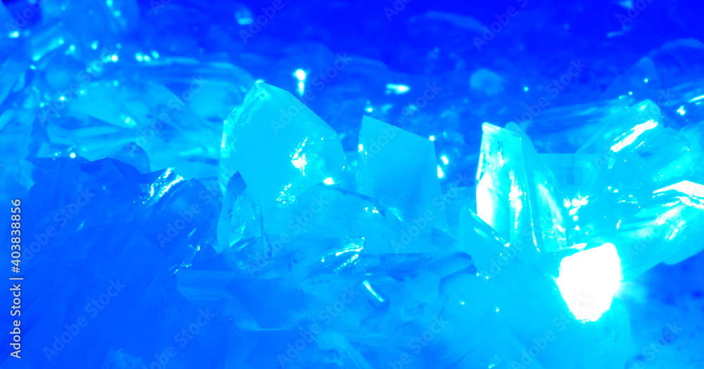 Fototapeta premium Macrophotography of blue transparent crystals of copper sulfate. Crystal surface texture.