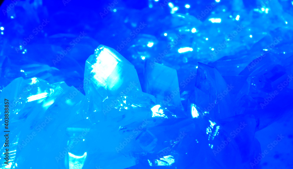 Macrophotography of blue transparent crystals of copper sulfate. Crystal surface texture. Macrophotography of blue transparent crystals of copper sulfate. Crystal surface texture.