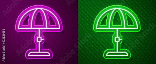 Glowing neon line Sun protective umbrella for beach icon isolated on purple and green background. Large parasol for outdoor space. Beach umbrella. Vector.