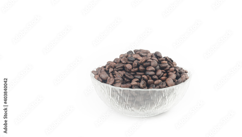 Roasted coffee beans in glass bowl isolated on white Roasted coffee beans in glass bowl isolated on white