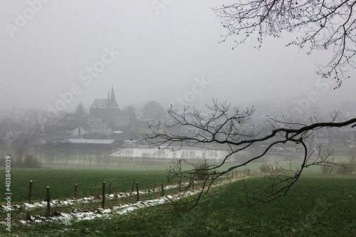 Hellefeld mit St. Martinus Kirche im Nebel -  Sauerland, erster Schnee photo
