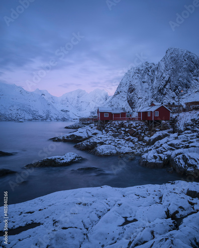 Wallpaper Mural Red Rorbu cabins on snow covered rocky coastline, Hamn√∏y, Lofoten Islands, Norway Torontodigital.ca