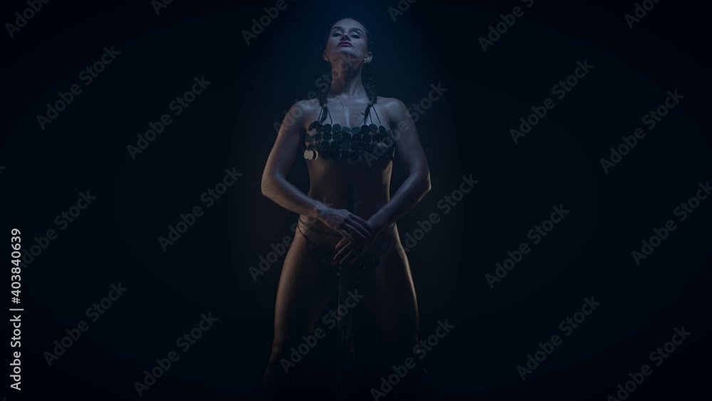 Amazon woman fantasy character, low key. Slow motion Amazon woman fantasy character, low key. Slow motion