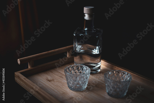 Mezcal bottle with glasses in a Mexican bar 