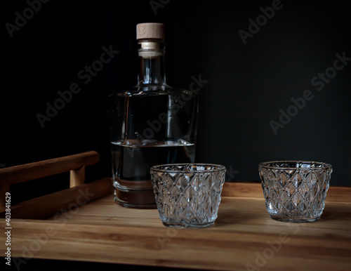 Mezcal bottle with glasses in a Mexican bar