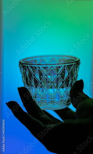 Mezcal glass holding by a Woman hand
