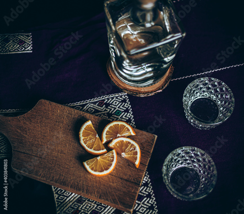 Mezcal bottle with glasses in a Mexican bar