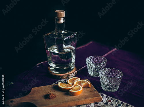 Mezcal and Orange on rustic Mexican bar 