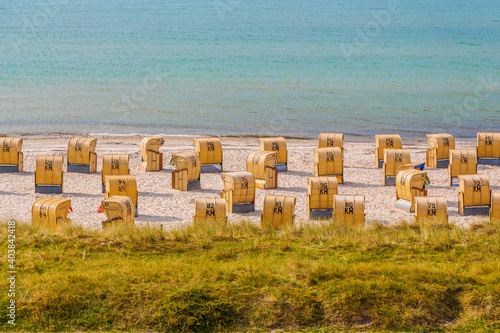 high angle view of beach chairs on sea behinde the dam