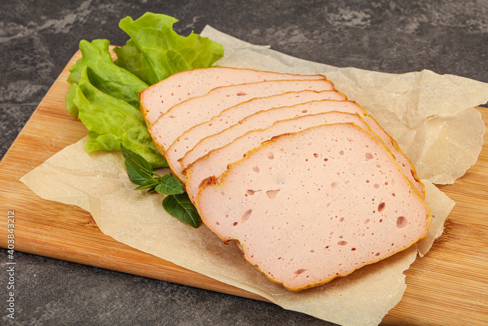 Boiled pork sausage over board