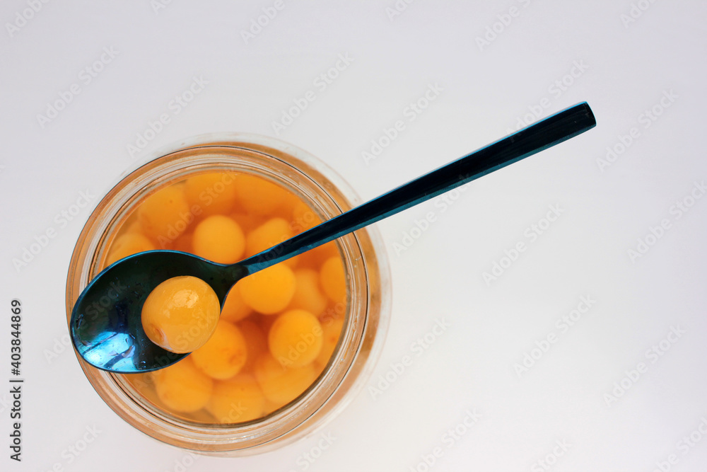 Homemade cherry fruit compote in glass jar. Preserved cherries in syrup on white background Homemade cherry fruit compote in glass jar. Preserved cherries in syrup on white background