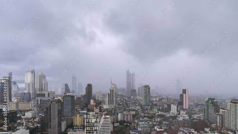 Bangkok business district city center with buildings and skyscrapers during rain or rainstorm - Time Lapse Bangkok business district city center with buildings and skyscrapers during rain or rainstorm - Time Lapse