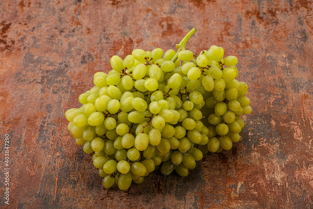 Green grape branch over background Green grape branch over background