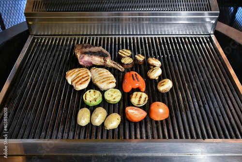 Grilling vegetables and fried meat