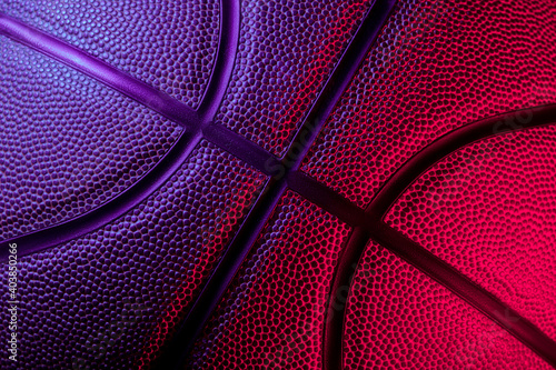 Closeup detail of basketball ball texture background. Blue neon Banner Art. Team sport concept © Augustas Cetkauskas