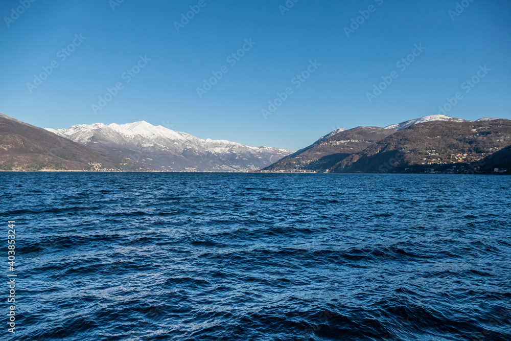 Lake Maggiore with the snow-capped mountains in the background Lake Maggiore with the snow-capped mountains in the background