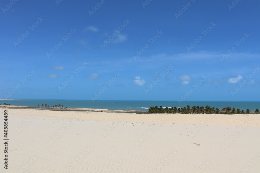 a dune, the sea and the blue sky 