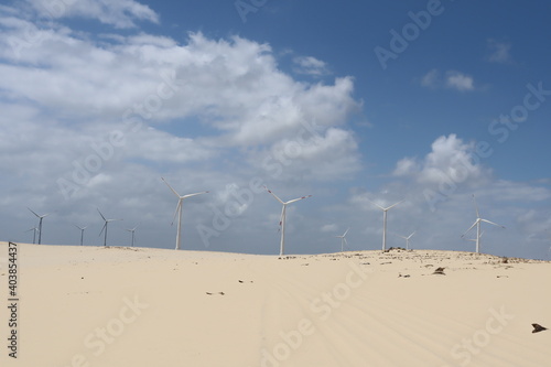 a dune with some Grass and the blue sky 