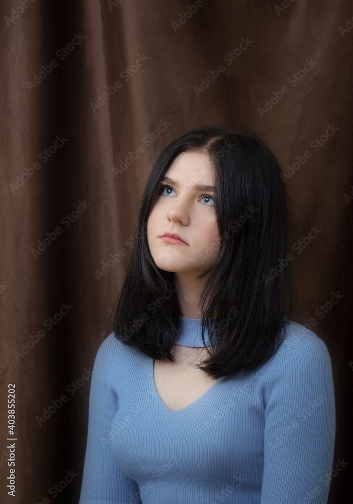 beautiful brunette teenager girl on dark background beautiful brunette teenager girl on dark background