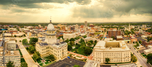Aerial panorama of the Illinois State Capitol dome and Springfield skyline under a dramatic sunset. Springfield is the capital of the U.S. state of Illinois and the county seat of Sangamon County photo