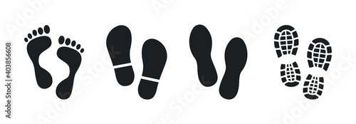 Human footprints. Bare foot prints. Shoe soles print. Black traces of human. Step footprints. Shoe tread prints.