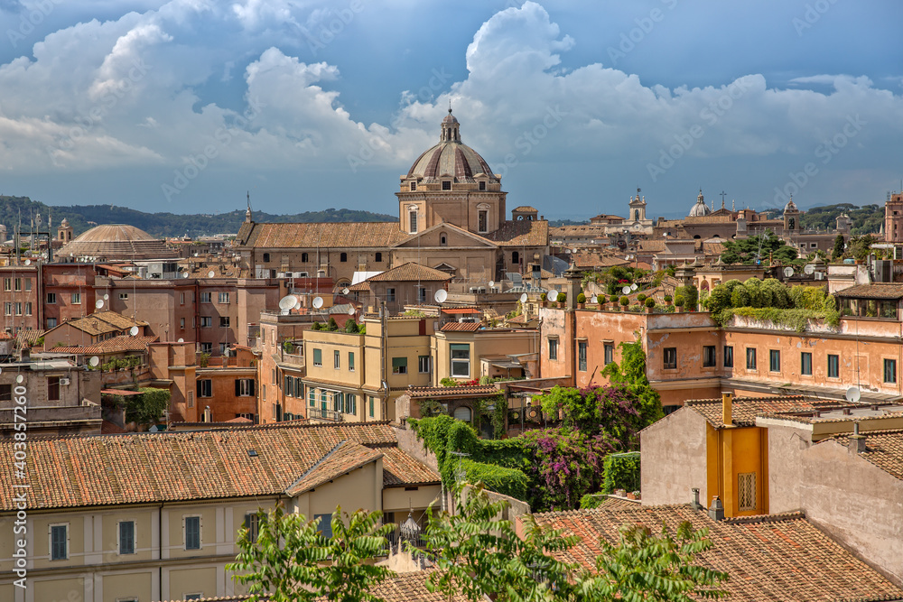 Rooftop view of the city skyline of Rome. Colorful vintage houses with terraces in Rome center. View of old beautiful architecture of Rome city, Italy