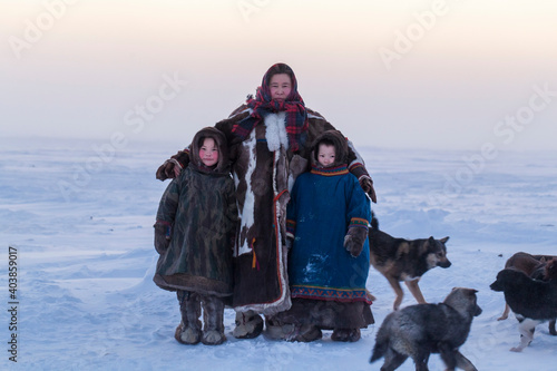Yamalo-Nenets Autonomous Okrug, extreme north, Nenets family in the national winter clothes of the northern inhabitants of the tundra, the Arctic circle, mother with children