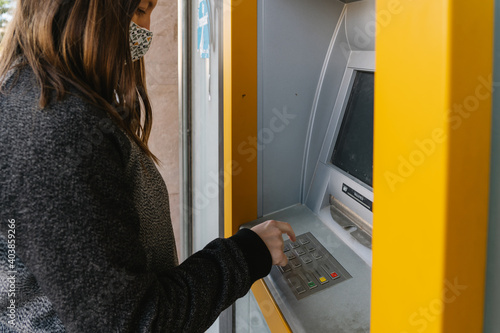 woman withdrawing money from an ATM