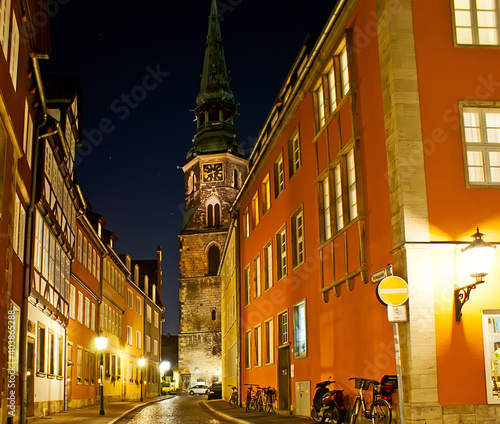 The Kreuzkirche and old houses in bright lights, Hanover, Germany photo