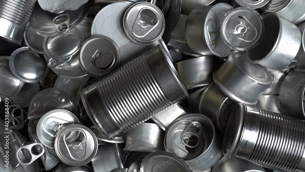 Metal tins, cans and jar garbage from household on the table. City home