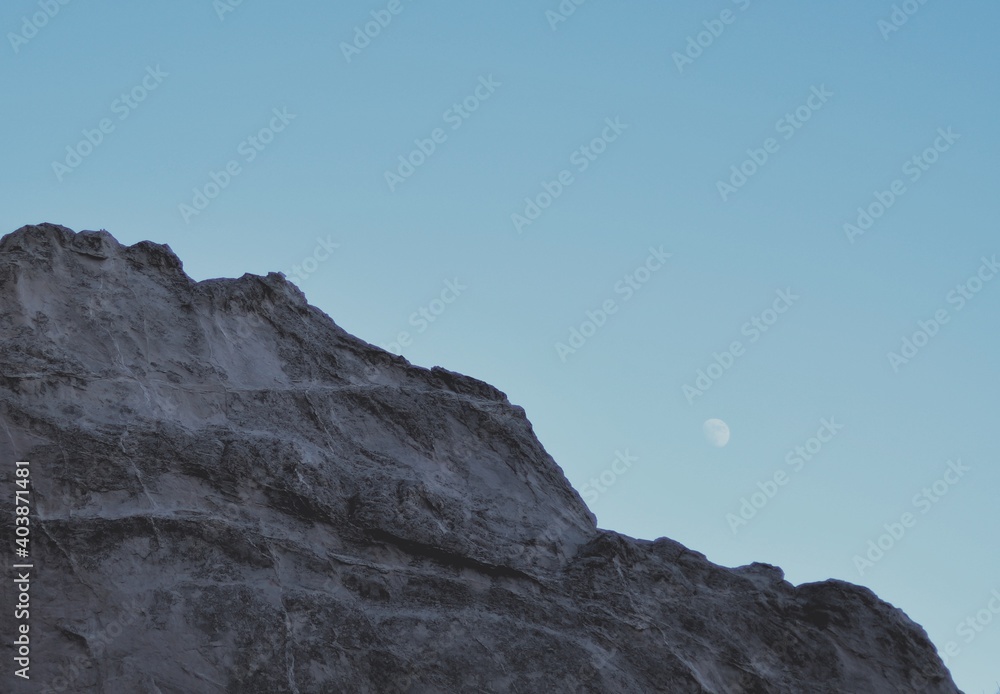 rock in the mountains with moon