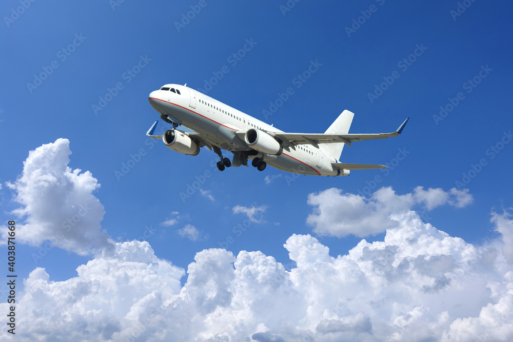 Zoom photo of passenger airplane taking off in deep blue sky and beautiful clouds Zoom photo of passenger airplane taking off in deep blue sky and beautiful clouds