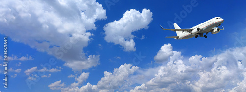Zoom photo of passenger airplane taking off in deep blue sky and beautiful clouds