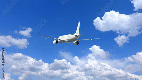 Zoom photo of passenger airplane flying in deep blue sky and beautiful clouds © aerial-drone