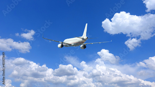 Zoom photo of passenger airplane flying in deep blue sky and beautiful clouds