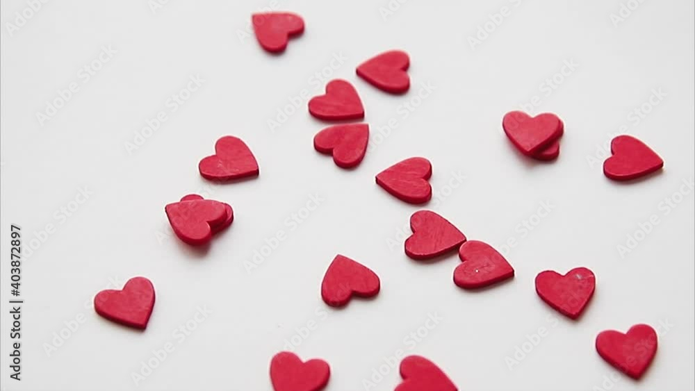 small red hearts sprinkle on white background, gift for valentine's day small red hearts sprinkle on white background, gift for valentine's day