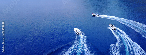 Canvas Print Aerial drone ultra wide top down photo of synchronised powerboats cruising in hi